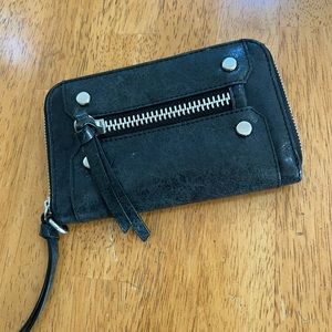 Like new. Edgy black leather wallet